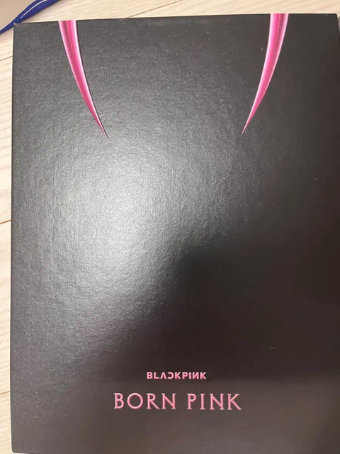 Blackpink photocards and opened albums, selling as a set.