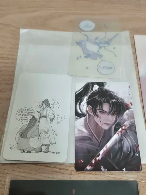 Selling unofficial Return of Mount Hua Sect postcards and photo cards.